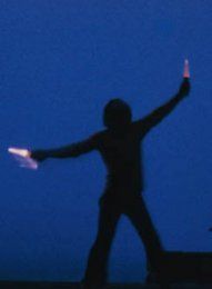 Bill curtsinger a ground control person guides a plane on an aircraft carrier