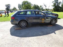 Car on scales at curby