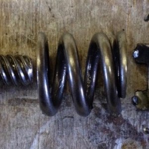 Handbrake return spring